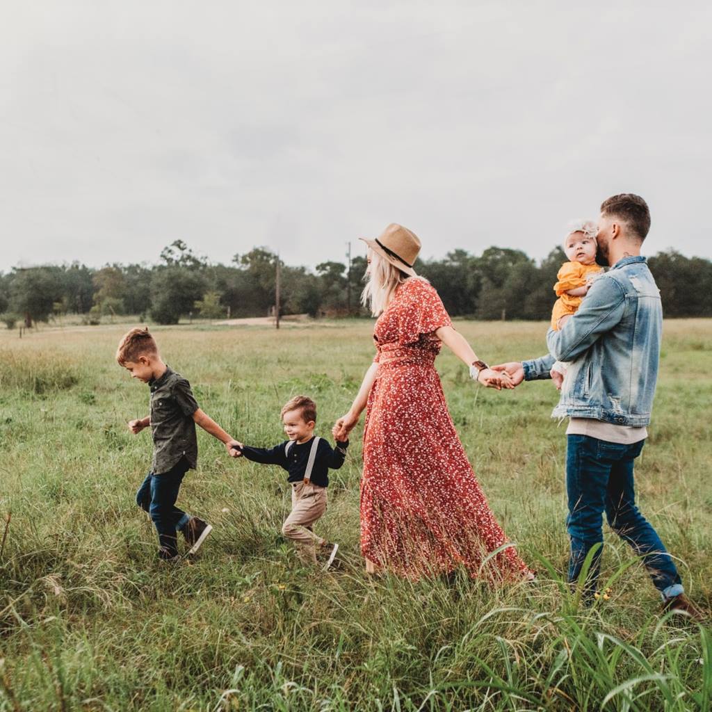 Family running through field
